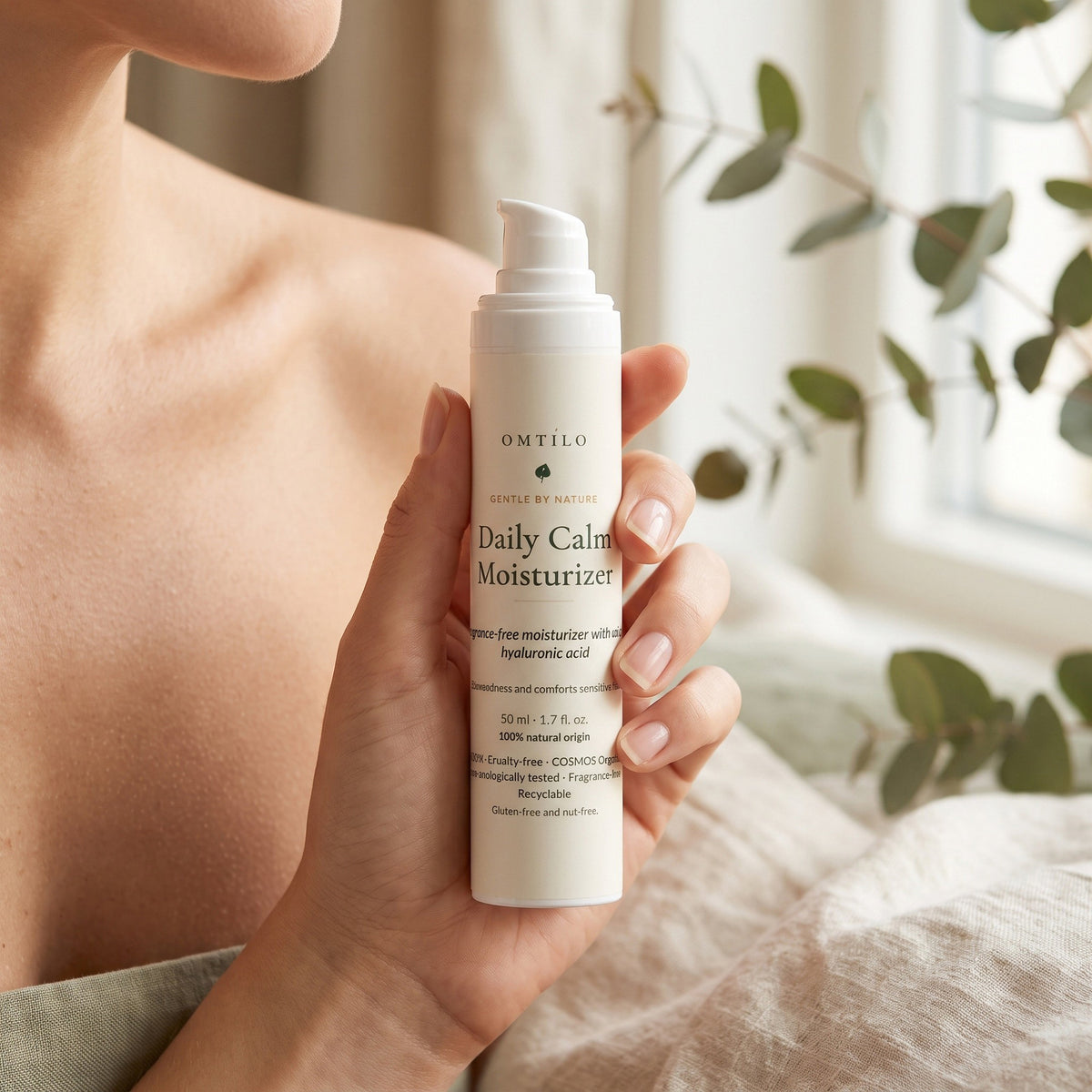 Daily Calm Moisturizer in hand on vanity