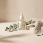 Quiet Glow Serum styled with eucalyptus